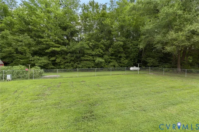 a view of outdoor space with deck and yard
