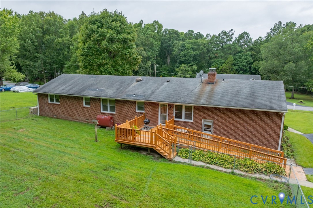 2570 Sandy Lane Victoria, VA 23974 - Photo 34 of 37 Back of house with a wooden deck, brick siding, he