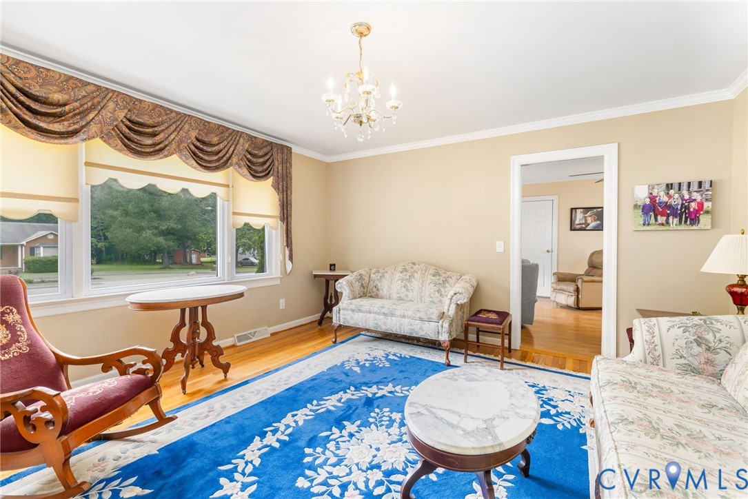 2570 Sandy Lane Victoria, VA 23974 - Photo 6 of 37 Living area featuring ornamental molding, wood fin