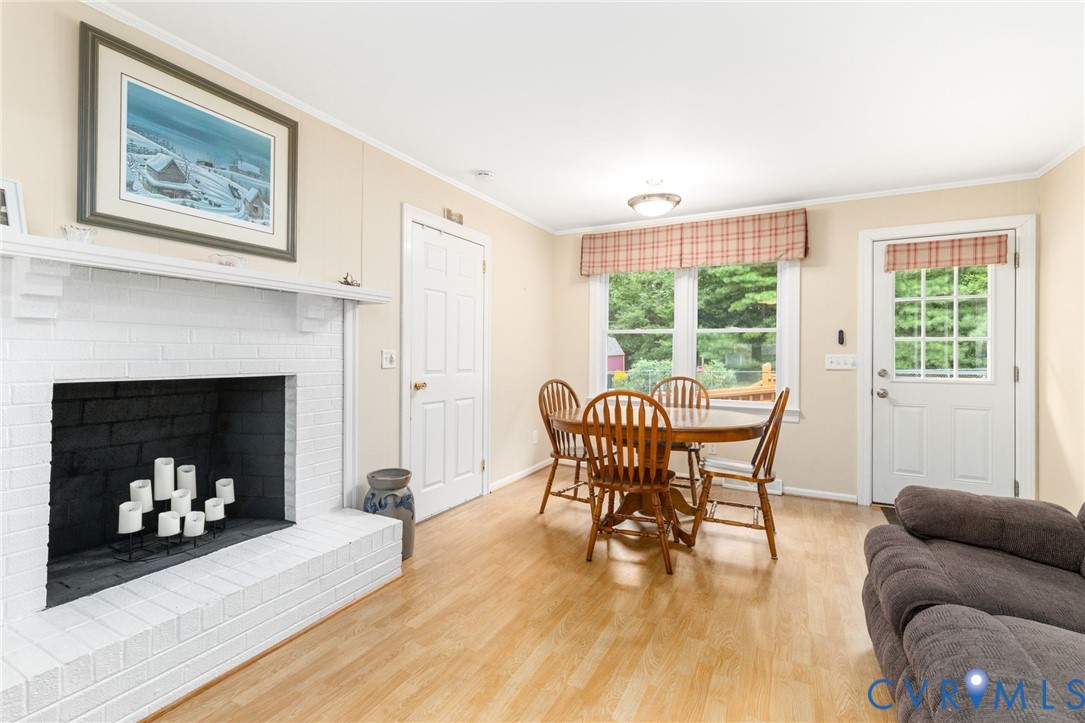 2570 Sandy Lane Victoria, VA 23974 - Photo 10 of 37 Family room with crown molding, a brick fireplace,
