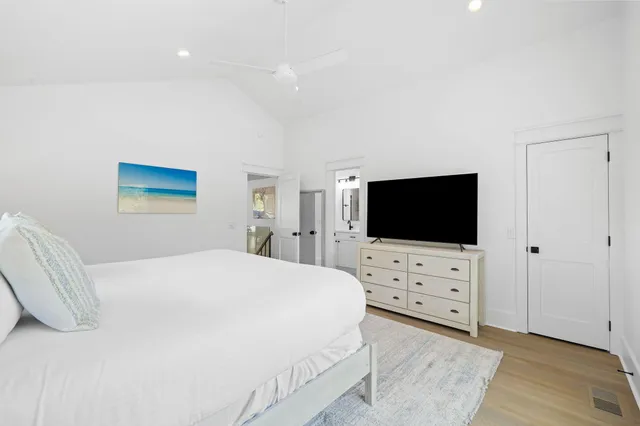 a bedroom with a bed and a view of bedroom