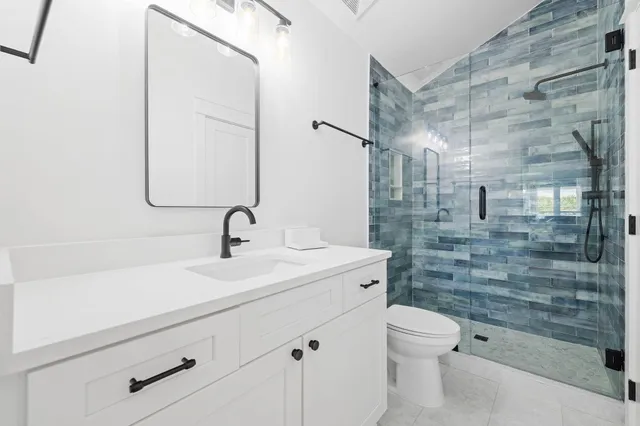 a bedroom with a bed and a potted plant