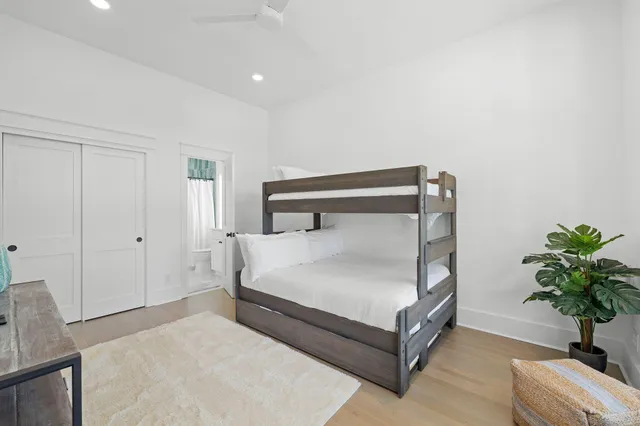 a bed room with a bed and a chair