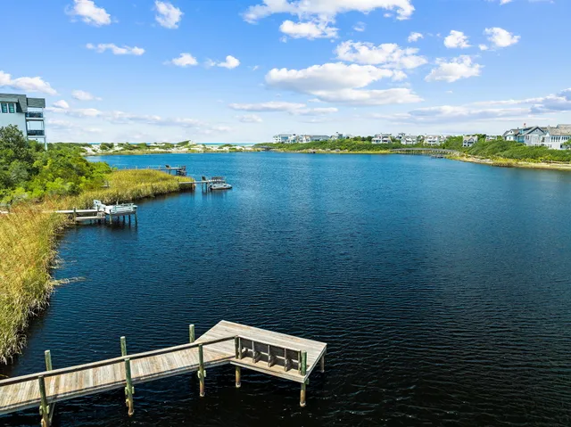 a view of a lake with a house in the background