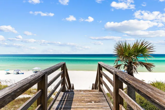 a view of a swimming pool and an outdoor seating
