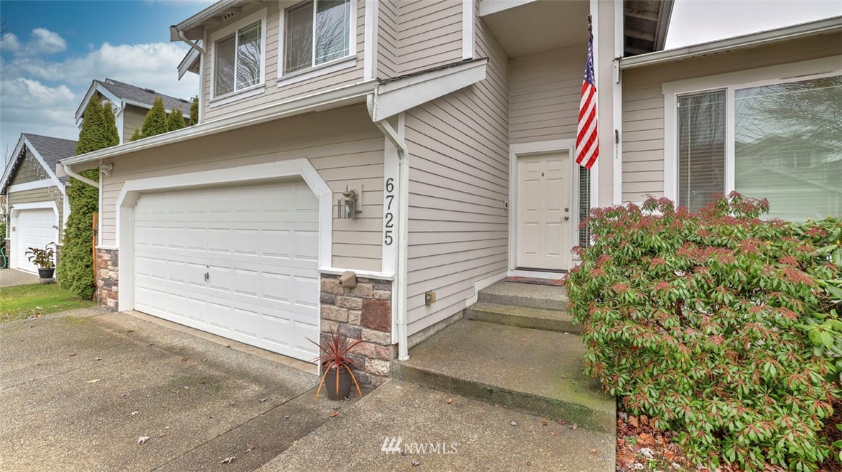 6725 Southeast 3rd Street Renton, WA 98059 - Photo 2 of 32 a front view of a house with a garage