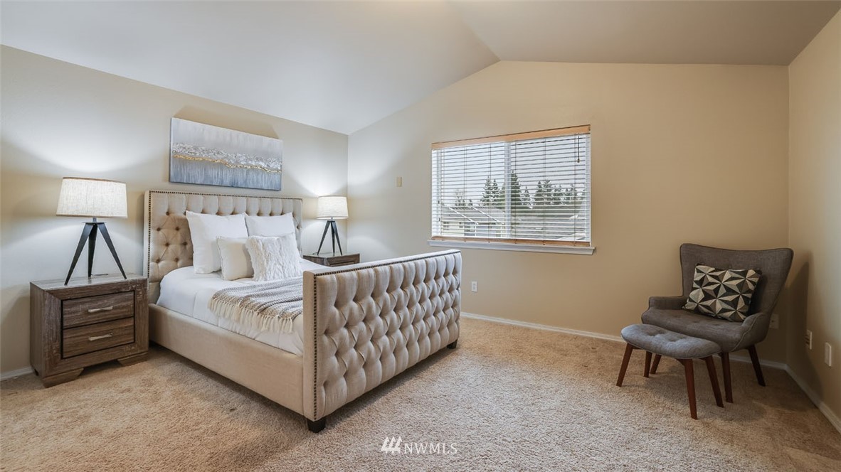 6725 Southeast 3rd Street Renton, WA 98059 - Photo 14 of 32 a bedroom with a bed and a lamp on table