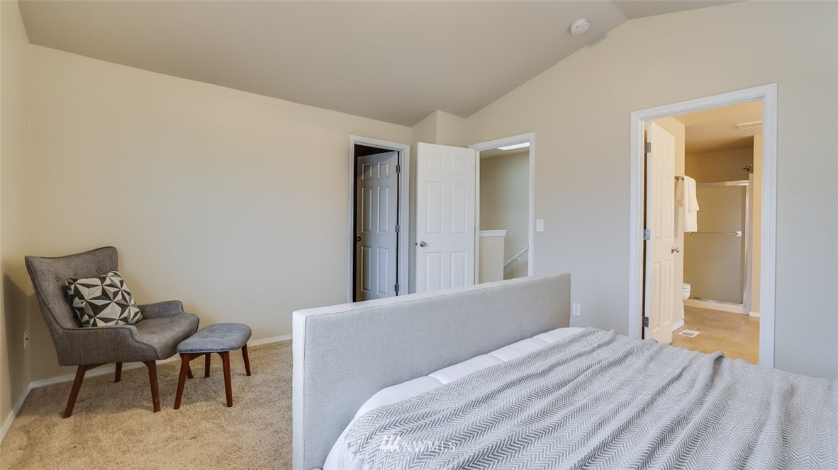 6725 Southeast 3rd Street Renton, WA 98059 - Photo 15 of 32 a bedroom with a bed and a chair