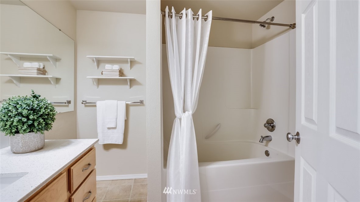 6725 Southeast 3rd Street Renton, WA 98059 - Photo 21 of 32 a bath room with a sink and a bath tub