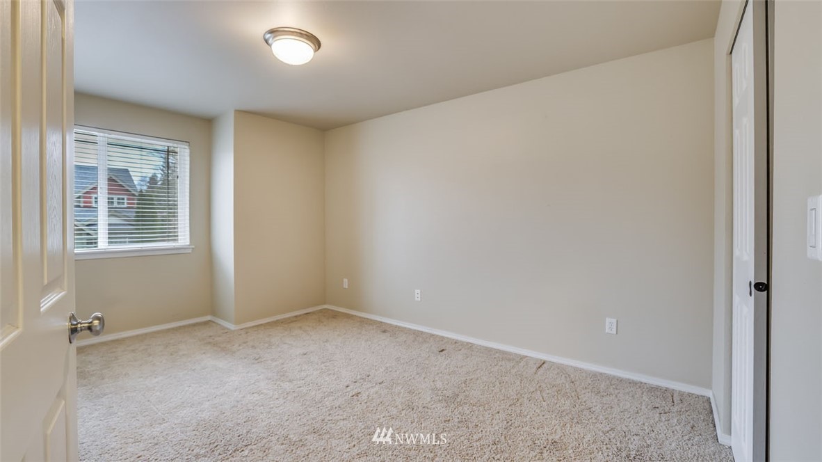 6725 Southeast 3rd Street Renton, WA 98059 - Photo 22 of 32 a view of an empty room with a window