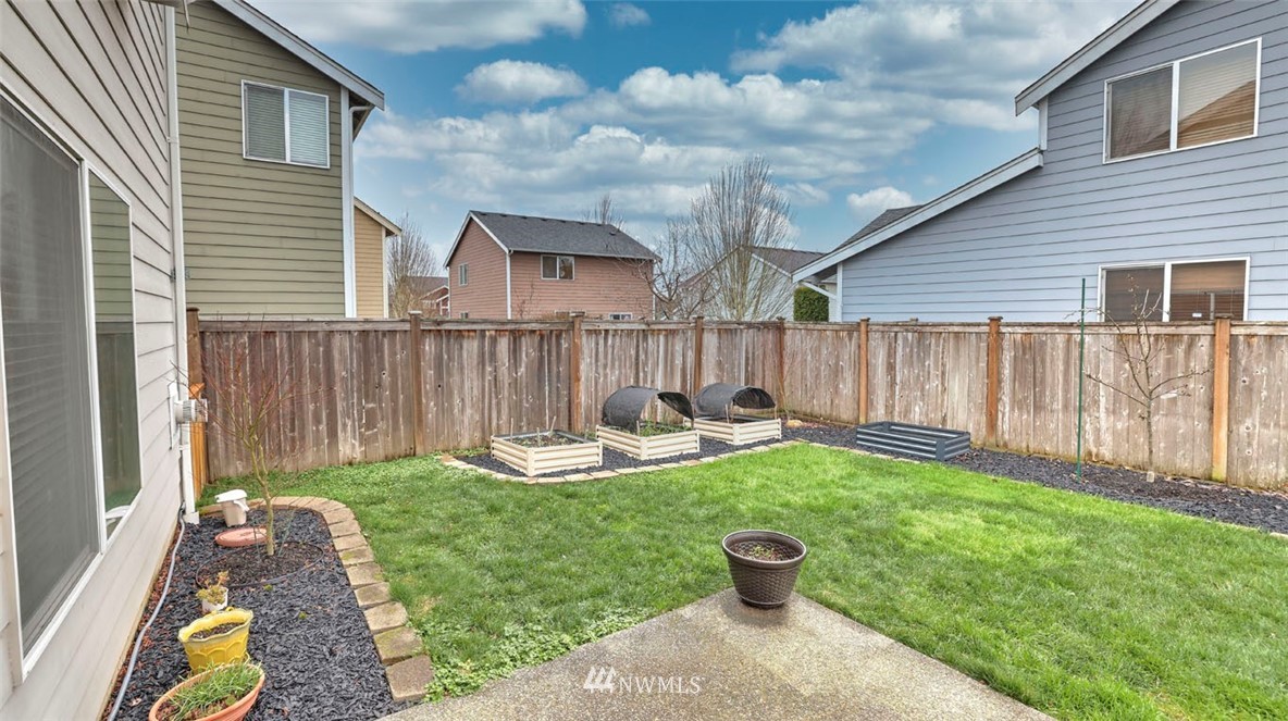 6725 Southeast 3rd Street Renton, WA 98059 - Photo 28 of 32 a view of a chair and table in backyard of the house