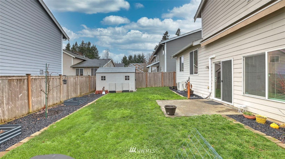 6725 Southeast 3rd Street Renton, WA 98059 - Photo 30 of 32 a view of a house with yard and a garden