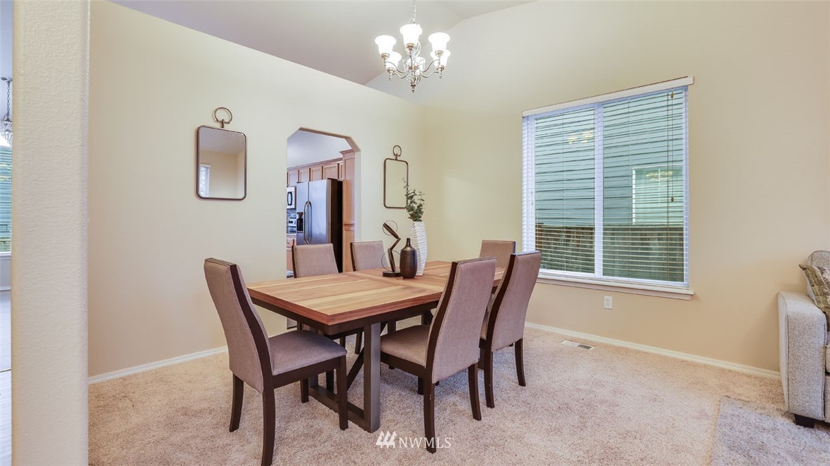 6725 Southeast 3rd Street Renton, WA 98059 - Photo 6 of 32 a view of a dining room with furniture and chandelier