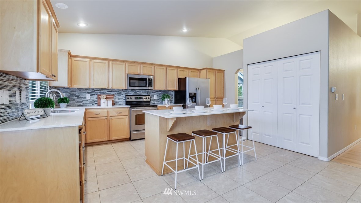 6725 Southeast 3rd Street Renton, WA 98059 - Photo 10 of 32 a kitchen with a sink cabinets and window