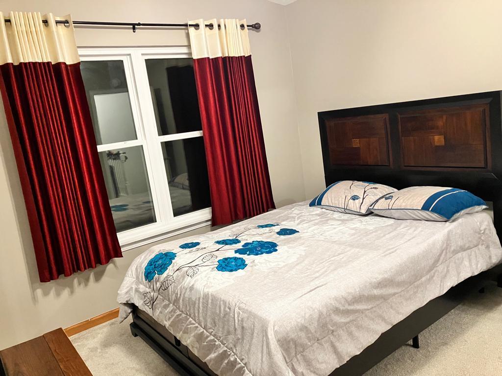 Undisclosed Address Round Lake Beach, IL 60073 - Photo 12 of 28 a bedroom with a bed and a walk in closet