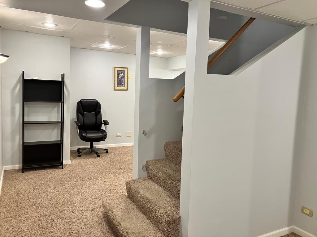 Undisclosed Address Round Lake Beach, IL 60073 - Photo 22 of 28 a living room with furniture and a rug