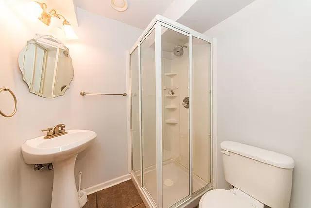 Undisclosed Address Round Lake Beach, IL 60073 - Photo 26 of 28 a bathroom with a sink toilet and shower