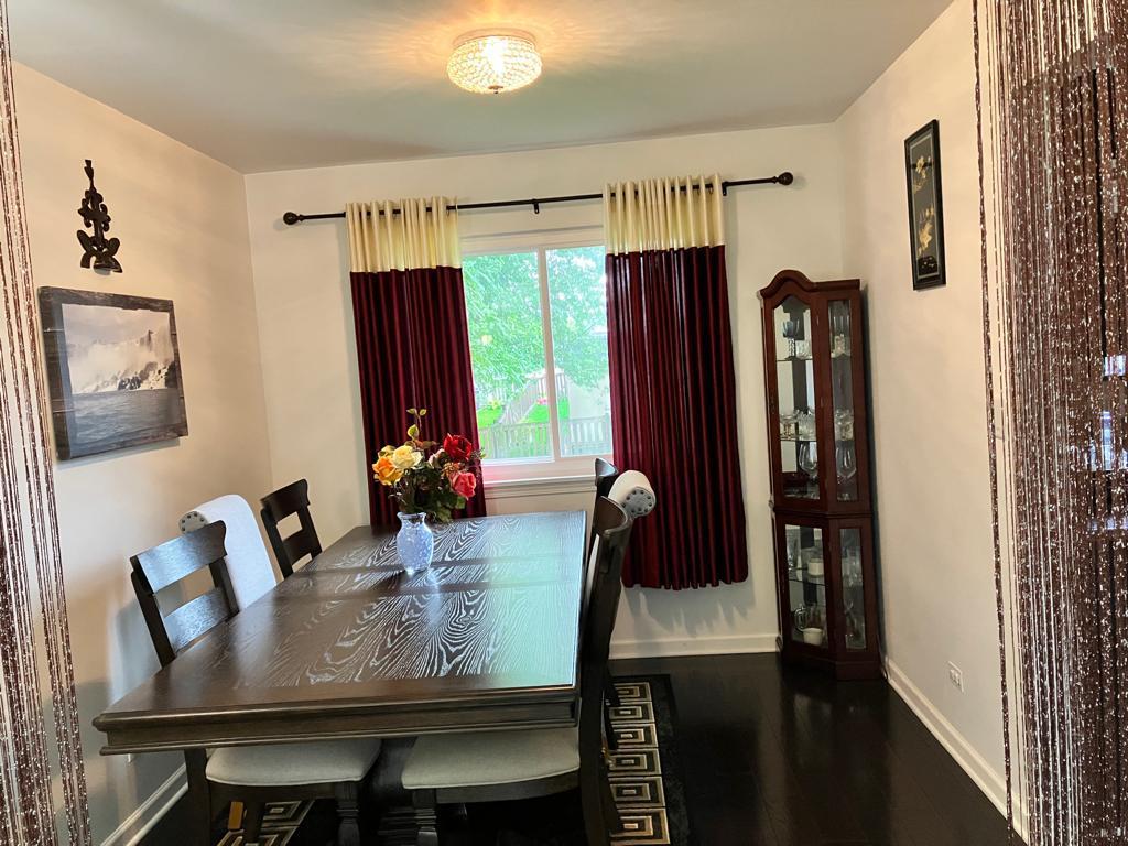Undisclosed Address Round Lake Beach, IL 60073 - Photo 5 of 28 a view of a dining room with furniture and window