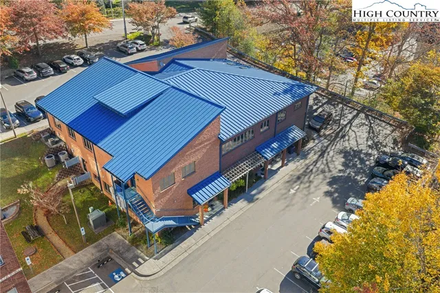a aerial view of a house with a yard