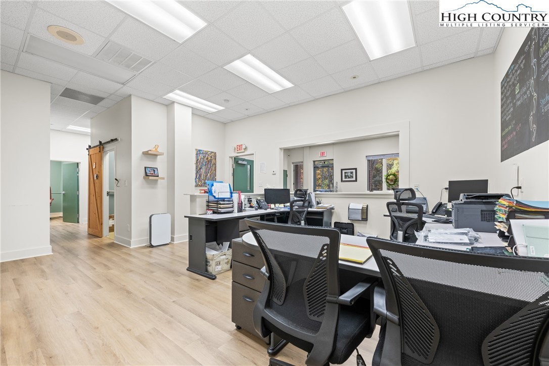 610 State Farm Road, Unit 3 Boone, NC 28607 - Photo 11 of 49 a dining hall with stainless steel appliances kitchen island granite countertop furniture and wooden floor