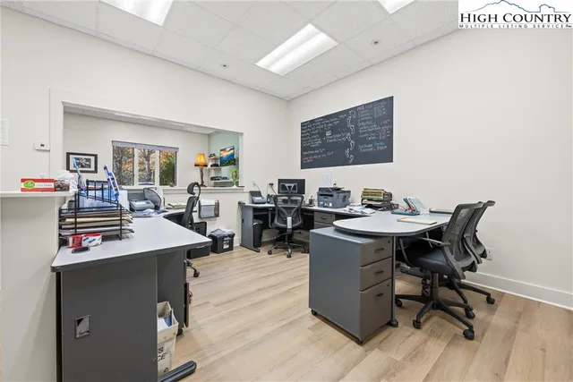 a view of a workspace with furniture