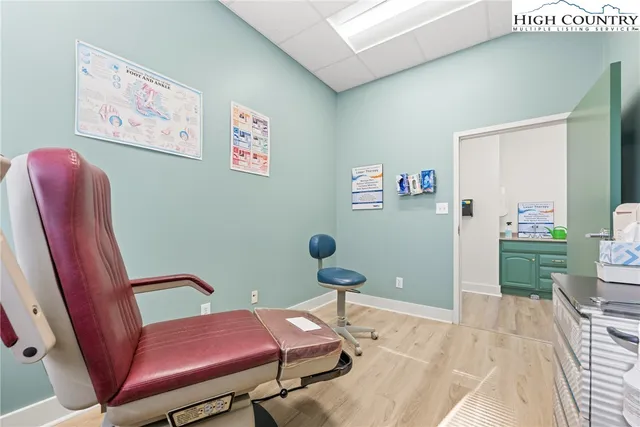 a bedroom with furniture and a chair