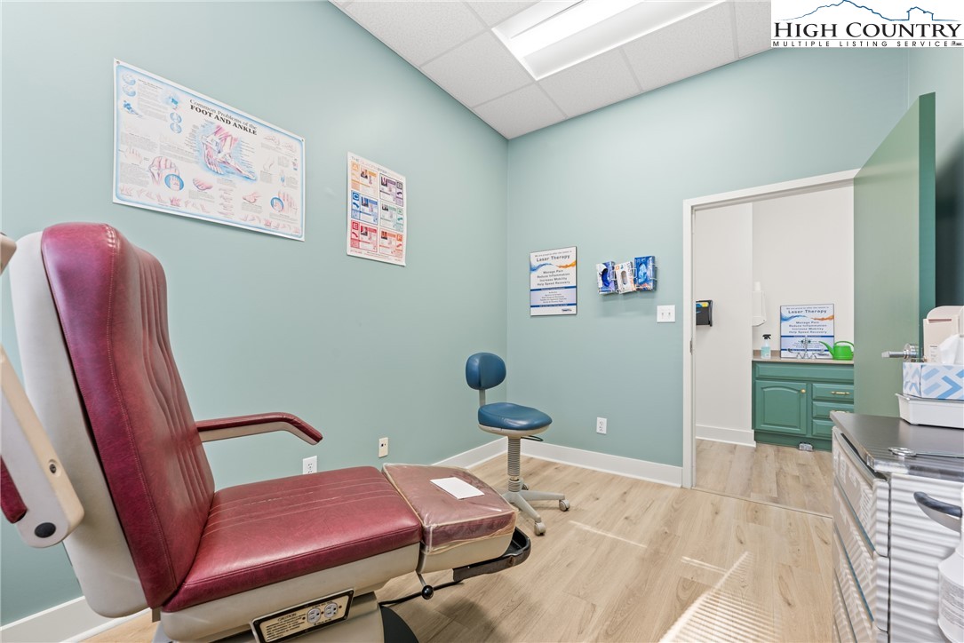 610 State Farm Road, Unit 3 Boone, NC 28607 - Photo 19 of 49 a bedroom with furniture and a chair