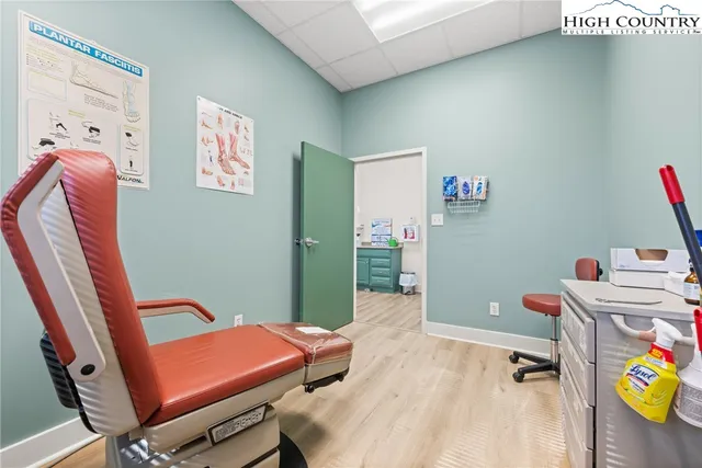 a room with furniture and a wooden floor