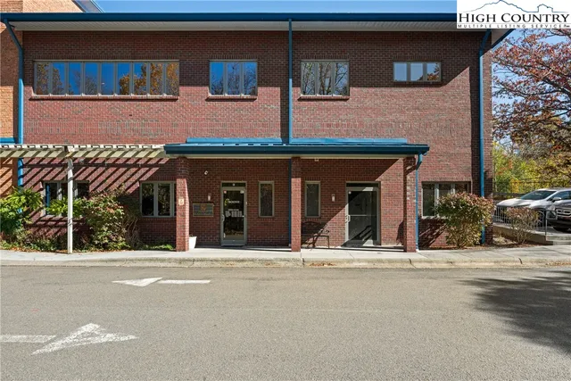 a view of a house with large windows