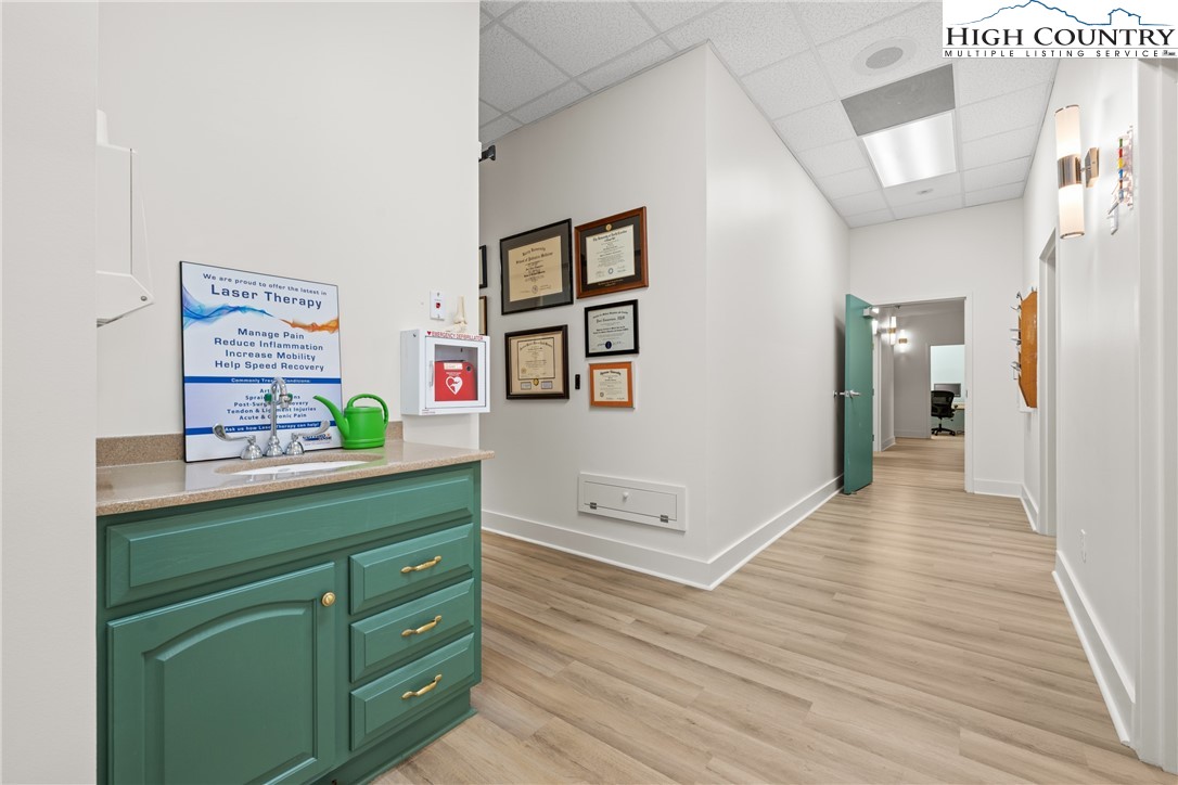 610 State Farm Road, Unit 3 Boone, NC 28607 - Photo 21 of 49 a view of hallway with wooden floor and furniture