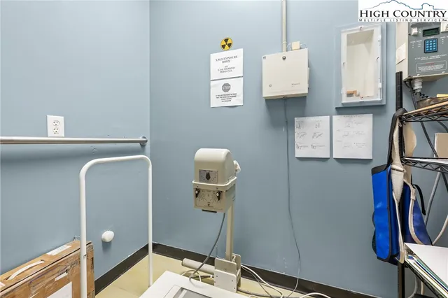 a bathroom with a sink mirror and vanity