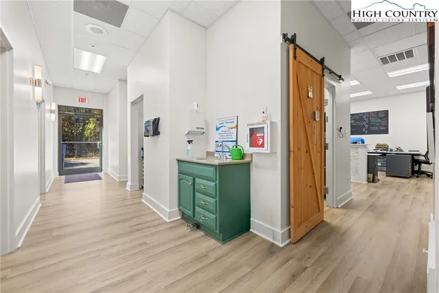 a view of a kitchen cabinets and wooden floor