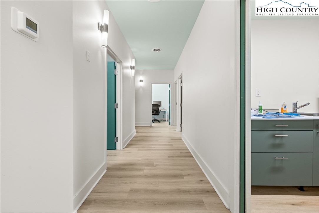 610 State Farm Road, Unit 3 Boone, NC 28607 - Photo 30 of 49 a view of a hallway with wooden floor