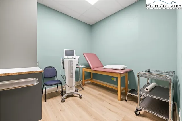 a view of a workspace with furniture