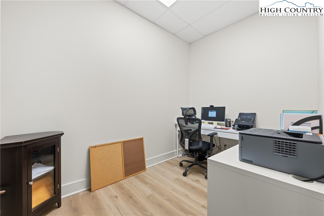 610 State Farm Road, Unit 3 Boone, NC 28607 - Photo 34 of 49 a view of workspace with wooden floor and white cabinet