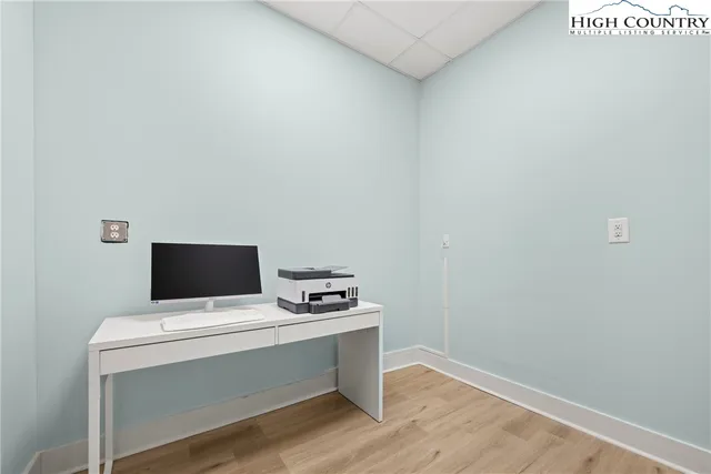 a room with a table and a fireplace