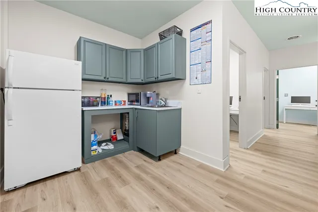 a room with cabinets and wooden floor