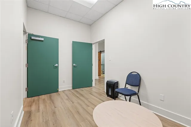 a bedroom with a bed and chair