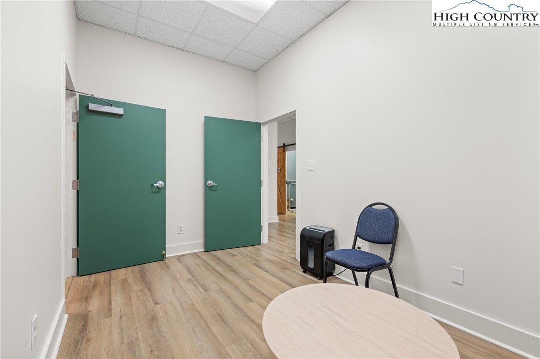 610 State Farm Road, Unit 3 Boone, NC 28607 - Photo 42 of 49 a bedroom with a bed and chair