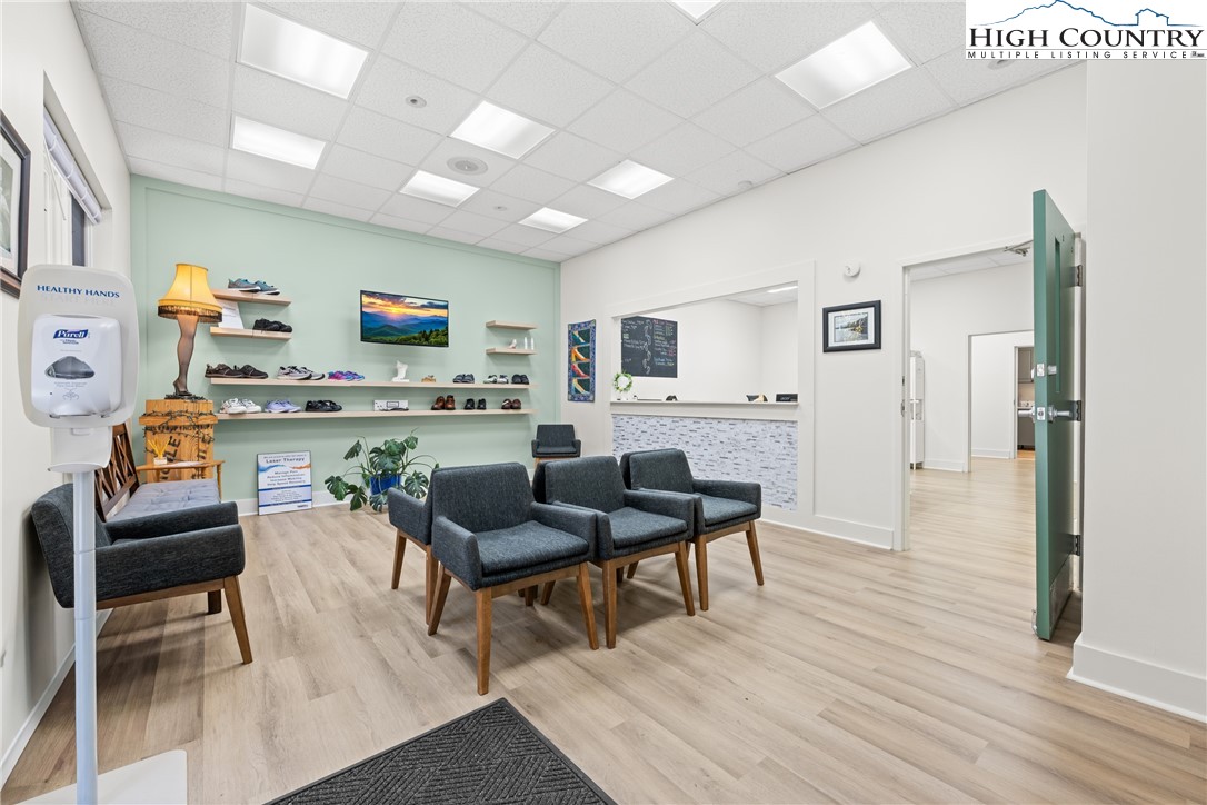 610 State Farm Road, Unit 3 Boone, NC 28607 - Photo 8 of 49 a living room with furniture and a flat screen tv