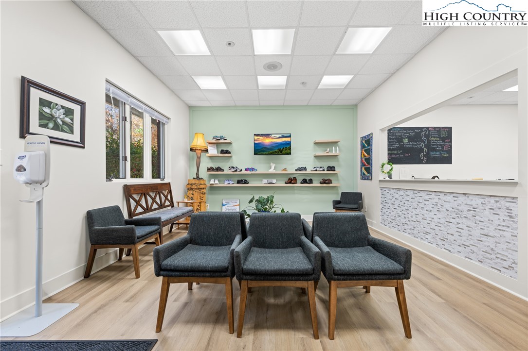 610 State Farm Road, Unit 3 Boone, NC 28607 - Photo 9 of 49 a living room with furniture and a flat screen tv
