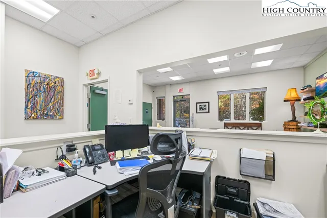 a workspace with furniture and window