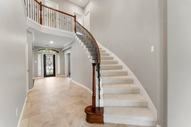a view of an entryway with wooden floor