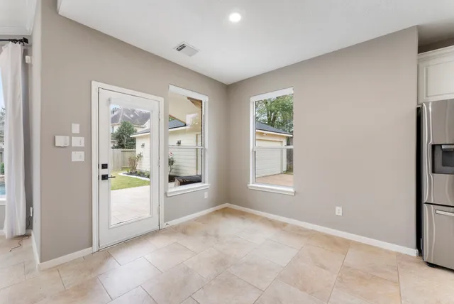 a view of an empty room with a window