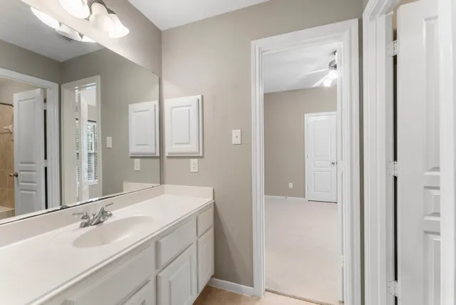 a bathroom with a double vanity sink and a mirror