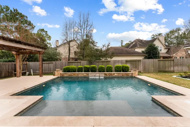 a view of a swimming pool with a patio