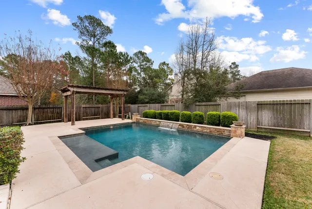 a view of a swimming pool with a patio