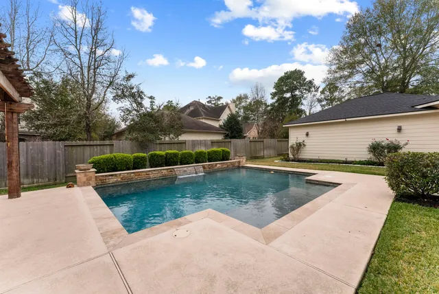 a view of a swimming pool with a patio