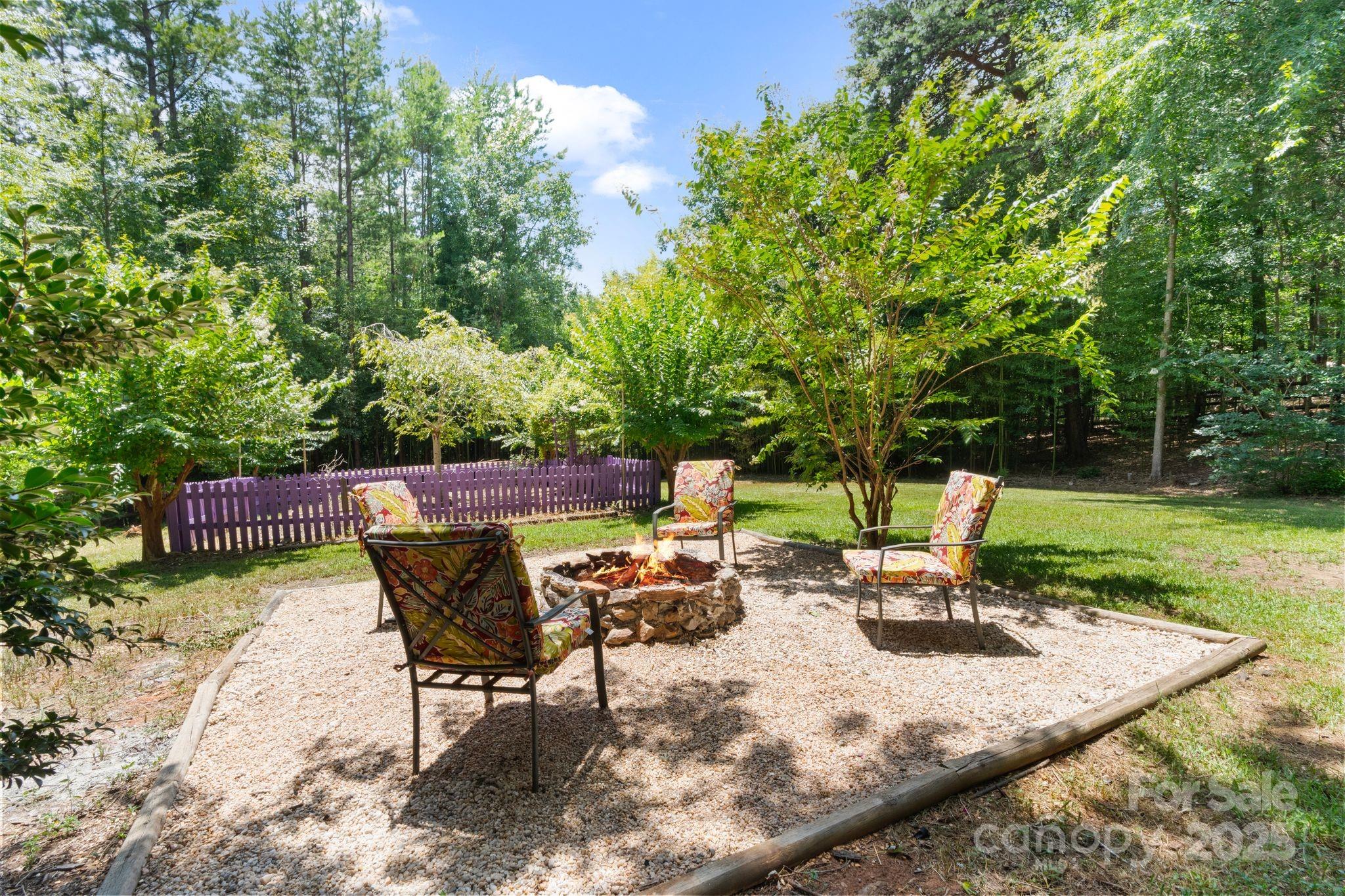 3211 Planters Ridge Road Charlotte, NC 28270 - Photo 23 of 43 a view of a chair and table on the garden
