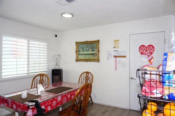 a view of a dining room with furniture window and outside view